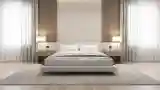 Wood Panel Ceiling and Cream Upholstered Bed