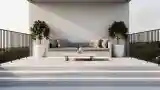 Elegancki balkon z betonem i szarą sofą
